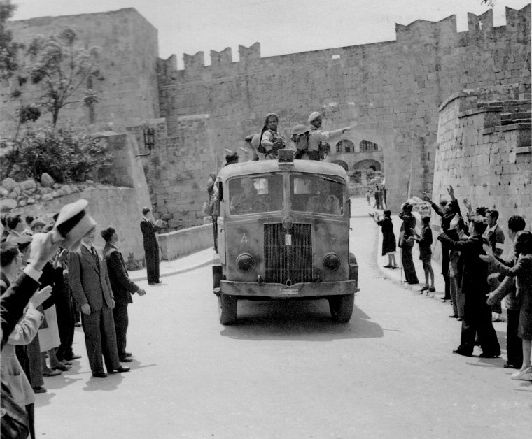 Crowd cheering troops