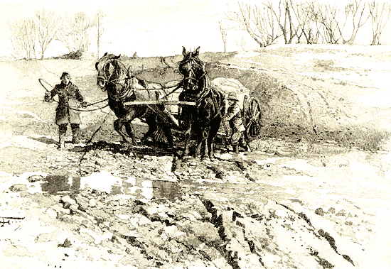 cart on a muddy road across a field